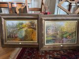 deux tableaux encadrés représentant une scène champêtre, posés sur un tapis dans une salle à manger