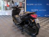 a scooter that is parked in a showroom
