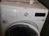 a washer and dryer sitting next to each other in a room