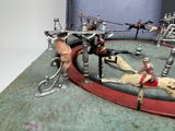 toy figurines of a man riding a horse in a circus
