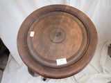 a wooden table with a wooden top on a white sheet