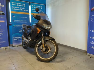 a motorcycle that is parked inside of a building