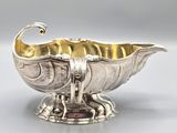 an antique silver plated bowl with a fish design on it