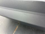 a close up of the front bumper of a car with scratches on it