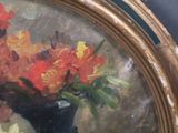 a painting of flowers in a black vase on a table