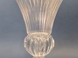 a glass vase that is sitting on a table