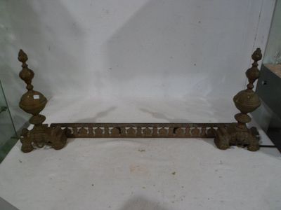 a metal shelf with candles on it in a glass case