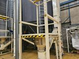 an image of a large industrial warehouse with a lot of shelves
