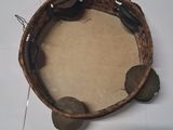 a picture of a small wooden bowl with coins in it