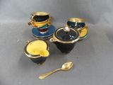 three cups and a spoon sitting on a table