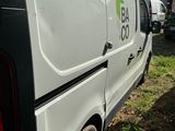 a white van with a ladder on the back of it
