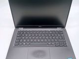 an open laptop computer sitting on top of a white table