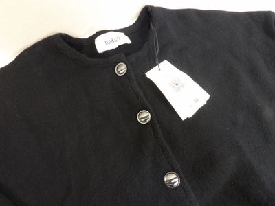 a close up of a black shirt with a tag on it