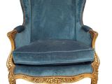 a blue chair with a gold frame and blue velvet upholstered