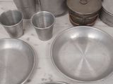 a lot of pots and pans that are on the table