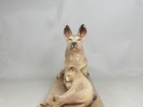 a figurine of a cat and a dog on a table
