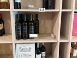 many bottles of wine on the shelves in the store