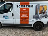 a van that is parked in front of a building