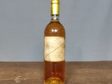 a bottle of wine that is sitting on a table