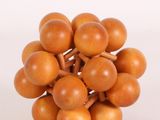 a bunch of small wooden balls on a white surface