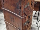 a wooden chest sitting on top of a table in a room