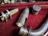 a metal pipe and a lighter sitting in a case