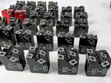 a lot of black and red dice pieces on a white table