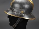a helmet on a mannequin head with a gold crown