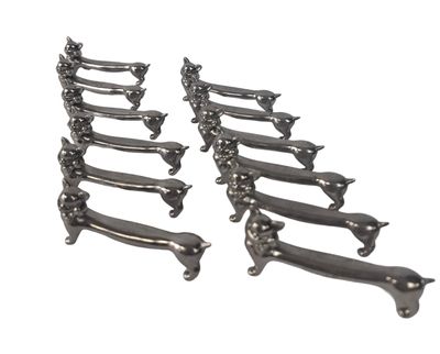 these are a set of six long metal handles on a white background