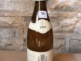 a bottle of wine that is sitting on a table
