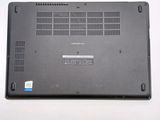 a black laptop with a blue sticker on the back of it