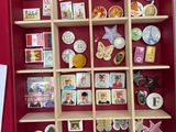 a red box filled with lots of different types of magnets