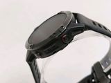 a close up of a smart watch on a white surface