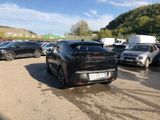 many cars parked in a parking lot in a lot