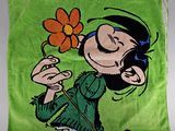 La couverture est verte et représente une petite fille tenant une fleur à la main.