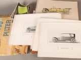 several old cars are sitting on top of a table next to a book