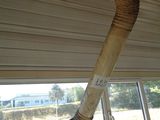 a large pipe sticking out of the ceiling of a bus