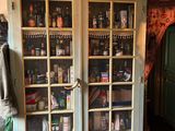a large cabinet with many items on top of it