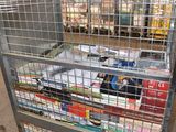 a metal cart with magazines on it in a warehouse