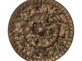 une image représentant une plaque en bronze ornée d'un motif