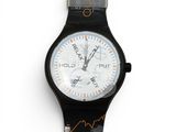 a close up of a wrist watch on a white surface