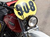 a close up of a motorcycle with a number plate on it