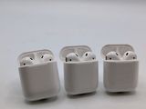 three white airpods sitting on top of each other on a white surface