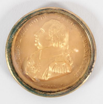 l'image d'une pièce d'or sur laquelle figure l'image d'un homme