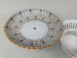 a white bowl and a white bowl on a table