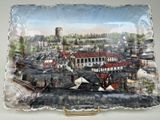 a plate with a picture of a city on it