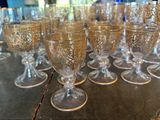 a lot of wine glasses sitting on a table