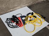 yellow and black electrical cords on a white sign on the ground