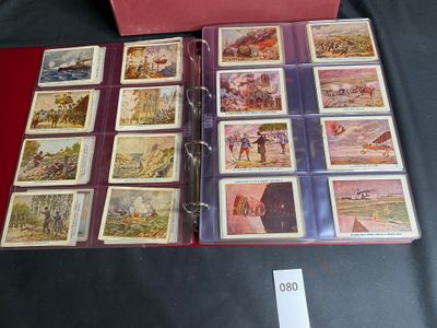 a lot of cards in a red box on a table