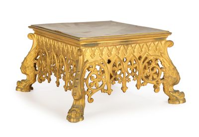 a gold table with a marble top on a white background